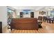 Relaxing living room features a stone fireplace and sliding door access to a patio at 6462 E Bates Ave, Denver, CO 80222
