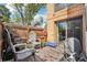 Private patio with wooden deck, seating, decor, and a grill, for outdoor entertaining at 6462 E Bates Ave, Denver, CO 80222