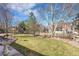 Large backyard with green grass with an bird bath, perfect for relaxing or entertaining outdoors at 5520 Morgan Way, Frederick, CO 80504