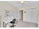 Neutral bedroom with a ceiling fan, large closet, and an adjacent study/workspace with desk at 5520 Morgan Way, Frederick, CO 80504