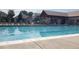 Community pool with lounge chairs, cabana, and clean blue water in a great neighborhood at 5520 Morgan Way, Frederick, CO 80504