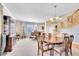 Spacious dining area featuring classic furniture, a chandelier, and lots of natural light, great for Gathering meals at 5520 Morgan Way, Frederick, CO 80504