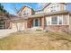 Charming two-story home with a well-manicured lawn and a cozy front porch, perfect for relaxing outdoors at 5520 Morgan Way, Frederick, CO 80504