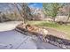 Beautiful front yard with a rock water feature and view of the charming two-story home at 5520 Morgan Way, Frederick, CO 80504