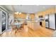 Well-lit kitchen with stainless steel appliances, wood cabinets, and granite countertops at 5520 Morgan Way, Frederick, CO 80504