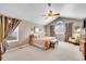 Spacious main bedroom featuring plush carpeting and a vaulted ceiling at 5520 Morgan Way, Frederick, CO 80504