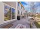 Back patio with a dining set, grill, and a sliding glass door leading inside the residence at 5520 Morgan Way, Frederick, CO 80504