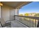 Private balcony with seating and a view of the surrounding area at 10437 W Hampden Ave # 202, Lakewood, CO 80227