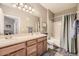 Bathroom with a shower/tub combo, double vanity, and linen closet at 10437 W Hampden Ave # 202, Lakewood, CO 80227