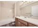 Clean bathroom with a single vanity and shower/tub combo at 10437 W Hampden Ave # 202, Lakewood, CO 80227