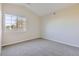 Simple bedroom with grey carpet and a window providing natural light at 10437 W Hampden Ave # 202, Lakewood, CO 80227