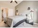 Spacious bedroom with a queen bed and access to a full bathroom at 10437 W Hampden Ave # 202, Lakewood, CO 80227