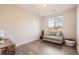 Cozy bedroom with a loveseat and plenty of natural light at 10437 W Hampden Ave # 202, Lakewood, CO 80227