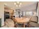 Charming dining area with a wooden table and chairs, near the kitchen at 10437 W Hampden Ave # 202, Lakewood, CO 80227