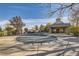 Community pool with safety cover and covered patio area at 10437 W Hampden Ave # 202, Lakewood, CO 80227