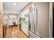 Efficient kitchen with stainless steel appliances and a view into the dining area at 1825 Kendall St # 107, Lakewood, CO 80214