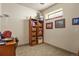 Basement office with built-in shelving and stained glass window at 14219 County Road 22, Fort Lupton, CO 80621