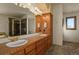 Bathroom boasts dual vanities and a large shower at 14219 County Road 22, Fort Lupton, CO 80621