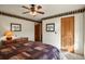 Spacious bedroom with a ceiling fan and large window at 14219 County Road 22, Fort Lupton, CO 80621