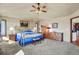 Main bedroom with brass bed frame and ample space at 14219 County Road 22, Fort Lupton, CO 80621