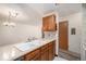 Well-lit kitchen with light countertops, tile backsplash, and wood cabinets at 14740 E Kentucky Dr # 716, Aurora, CO 80012