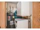 Laundry room featuring a washer, dryer, and water heater at 14740 E Kentucky Dr # 716, Aurora, CO 80012