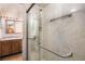 Updated bathroom featuring a glass-enclosed shower with sleek hardware and marble-look tile at 14740 E Kentucky Dr # 716, Aurora, CO 80012