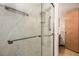 Contemporary bathroom featuring a glass-enclosed shower with sleek hardware and marble-look tile at 14740 E Kentucky Dr # 716, Aurora, CO 80012