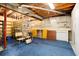 Unfinished basement with shelving and workbench at 6926 S Saulsbury St, Littleton, CO 80128