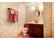 Basement bathroom with vanity and updated toilet at 6926 S Saulsbury St, Littleton, CO 80128