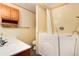 Accessible bathroom with walk-in shower and bathtub at 6926 S Saulsbury St, Littleton, CO 80128