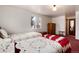 Cozy bedroom featuring two twin beds and a wood dresser at 6926 S Saulsbury St, Littleton, CO 80128