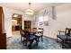 Dining room with a table and chairs, and a view into the kitchen at 6926 S Saulsbury St, Littleton, CO 80128