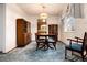 Spacious dining room with a wooden table and built-in hutch at 6926 S Saulsbury St, Littleton, CO 80128