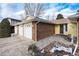 Brick ranch home with 3-car garage and entryway at 6926 S Saulsbury St, Littleton, CO 80128