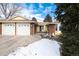 Brick ranch home with 3-car garage, and partially visible snow at 6926 S Saulsbury St, Littleton, CO 80128