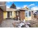 House exterior with 3-car garage and entryway at 6926 S Saulsbury St, Littleton, CO 80128