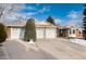 3-car garage, brick ranch home with partially visible snow at 6926 S Saulsbury St, Littleton, CO 80128