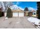 3-car garage, brick front, and partially visible snow at 6926 S Saulsbury St, Littleton, CO 80128