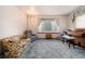 Living room with bay window, seating area, and vintage organ at 6926 S Saulsbury St, Littleton, CO 80128