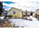 House exterior and snowy backyard at 6926 S Saulsbury St, Littleton, CO 80128