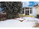 Backyard with snow, trees, and patio at 6926 S Saulsbury St, Littleton, CO 80128