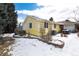 House exterior and snowy backyard at 6926 S Saulsbury St, Littleton, CO 80128