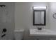 This bathroom has updated fixtures, a modern vanity, and tile at 7042 W 76Th Ave, Arvada, CO 80003