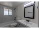 This bathroom features a updated shower, fixtures, vanity and contemporary tiling at 7042 W 76Th Ave, Arvada, CO 80003