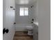 Bathroom features updated vanity, fixtures, and shower with modern tiling at 7042 W 76Th Ave, Arvada, CO 80003