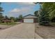 Exterior angle of a beautiful single-story house showing off the long driveway and 2-car garage at 7042 W 76Th Ave, Arvada, CO 80003