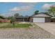 Beautifully maintained single-story home with a brick facade and a spacious two car garage at 7042 W 76Th Ave, Arvada, CO 80003