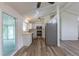 Updated kitchen with stainless steel appliances, modern counters, and sliding door access at 7042 W 76Th Ave, Arvada, CO 80003