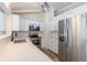Updated kitchen with stainless steel appliances, countertops, and shaker cabinets at 7042 W 76Th Ave, Arvada, CO 80003